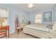 Cozy bedroom with comfortable bed, desk, and natural light from the window at 1069 W Rebound Rd, Van Wyck, SC 29720