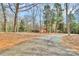 Long driveway leading to a charming brick home nestled among mature trees and lush landscaping at 1069 W Rebound Rd, Van Wyck, SC 29720