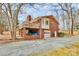 Back exterior view of brick home with walkout basement and wooden deck at 1069 W Rebound Rd, Van Wyck, SC 29720