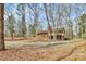 Charming brick two-story home with a deck, surrounded by mature trees on a large, leafy lot at 1069 W Rebound Rd, Van Wyck, SC 29720