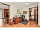 Functional home office with desk space, adjacent to a living area with a fireplace at 1069 W Rebound Rd, Van Wyck, SC 29720