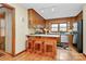 Cozy kitchen with wood cabinets, breakfast bar, and adjacent dining space at 1069 W Rebound Rd, Van Wyck, SC 29720