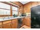 Well-lit kitchen featuring wood cabinets, stainless steel dishwasher, and ample counter space at 1069 W Rebound Rd, Van Wyck, SC 29720