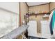 Practical laundry room with washer, dryer, and storage shelves at 1069 W Rebound Rd, Van Wyck, SC 29720