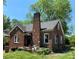 Charming brick home featuring a prominent chimney and inviting front porch, perfect for relaxing outdoors at 107 Lineberger St # 6, Shelby, NC 28150