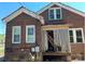 Classic brick home showcasing a covered porch and inviting entrance, blending traditional charm with modern appeal at 107 Lineberger St # 6, Shelby, NC 28150
