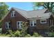 Well-lit brick home with white-trimmed windows, nestled in a leafy neighborhood, blending comfort and style at 107 Lineberger St # 6, Shelby, NC 28150