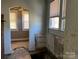 Bright room with large window and a view to an adjacent room, ready for remodel and custom finishes at 107 Lineberger St # 6, Shelby, NC 28150