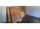 Unfinished room with plywood leaning against the wall, awaiting transformation into a personalized space at 107 Lineberger St # 6, Shelby, NC 28150