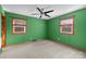 This bedroom features green walls, carpeted floors, a ceiling fan and a window with blinds at 108 Donna Ave, Gastonia, NC 28052