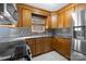 Kitchen with wood cabinets, granite countertops, tile backsplash, and stainless steel appliances at 108 Donna Ave, Gastonia, NC 28052