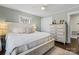 Comfortable bedroom featuring a king-size bed, ceiling fan, and natural light at 108 S Buckoak St, Stanley, NC 28164