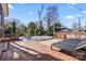 Relax on this expansive deck, which includes an above ground pool and space for sunbathing at 108 S Buckoak St, Stanley, NC 28164