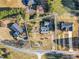 Aerial view of a cozy home with mature trees and a large yard surrounded by other well-kept homes at 111 Oakwood Dr, Kings Mountain, NC 28086