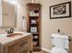 Charming bathroom with ornate vanity, copper sink, and classic fixtures at 111 Oakwood Dr, Kings Mountain, NC 28086