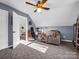 Relaxing bedroom with accent chair, wood furniture, neutral colors, and good sunlight, perfect for a cozy atmosphere at 111 Oakwood Dr, Kings Mountain, NC 28086