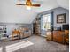Comfortable bedroom featuring neutral paint, ceiling fan, chair, and ample storage, perfect for relaxing and unwinding at 111 Oakwood Dr, Kings Mountain, NC 28086