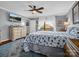 Bedroom with ceiling fan, large bed, and plenty of natural light at 111 Oakwood Dr, Kings Mountain, NC 28086