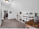 Upstairs living room showcasing built-in shelving, neutral color scheme, wood accents, and cozy carpet, ideal for entertainment at 111 Oakwood Dr, Kings Mountain, NC 28086