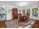 Charming dining room with natural light, wood table and chairs, and hardwood floors at 111 Oakwood Dr, Kings Mountain, NC 28086