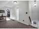 Bright hallway with neutral colors and carpet flooring, connecting different parts of the home at 111 Oakwood Dr, Kings Mountain, NC 28086