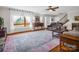 Bright living room with hardwood floors, a large window, plush sofas, and staircase at 111 Oakwood Dr, Kings Mountain, NC 28086
