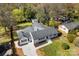 An aerial view of the home highlighting the landscape, roof, hardscaping and driveway at 1121 S Edgemont Ave, Gastonia, NC 28054