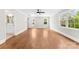 Bright bedroom with refinished hardwood floors, fresh paint, modern ceiling fan, and natural light from new windows at 1121 S Edgemont Ave, Gastonia, NC 28054
