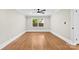 Bright, spacious bedroom featuring hardwood floors and a modern ceiling fan at 1121 S Edgemont Ave, Gastonia, NC 28054