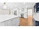 Bright kitchen with stainless steel appliances, a large island, and white cabinetry at 1121 S Edgemont Ave, Gastonia, NC 28054