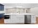 Large kitchen island with white cabinetry, a farmhouse sink, and stainless steel appliances at 1121 S Edgemont Ave, Gastonia, NC 28054