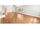 Bright living room showcasing beautiful hardwood floors, neutral walls, and lots of natural light at 1121 S Edgemont Ave, Gastonia, NC 28054
