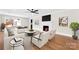 Cozy living room with a fireplace, hardwood floors, and a ceiling fan at 1121 S Edgemont Ave, Gastonia, NC 28054