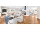 Open-concept living area with hardwood floors, contemporary furniture, and access to kitchen at 1121 S Edgemont Ave, Gastonia, NC 28054