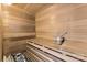 Beautiful sauna featuring wood paneled walls and ceilings plus comfortable seating and a bucket with a handle for relaxing at 1121 S Edgemont Ave, Gastonia, NC 28054