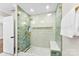 Updated shower with rainfall showerhead, glass door, built-in bench, and decorative tile at 1121 S Edgemont Ave, Gastonia, NC 28054