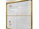 The bathroom shower has glass doors with gold trim and gold fixtures at 1121 S Edgemont Ave, Gastonia, NC 28054