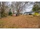 Spacious backyard with mature trees and shed at 113 Galilean Rd, York, SC 29745