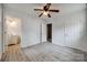 Bedroom featuring neutral walls, plank flooring, ceiling fan and connected bathroom at 113 Galilean Rd, York, SC 29745