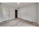 Bedroom featuring neutral walls, plank flooring, and access to a half bathroom at 113 Galilean Rd, York, SC 29745