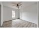 Bright bedroom featuring hardwood floors, a ceiling fan, and a sunlit window at 113 Galilean Rd, York, SC 29745