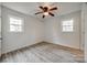 This bedroom features neutral walls, plank flooring, and a ceiling fan at 113 Galilean Rd, York, SC 29745
