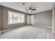 Spacious bedroom with new plank floors, ceiling fan, bay window, and ample natural light and closet space at 113 Galilean Rd, York, SC 29745