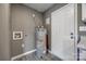 Utility area features modern water heater, clean flooring, and utility sink at 113 Galilean Rd, York, SC 29745