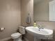 Functional half bathroom with a pedestal sink and a neutral color scheme at 11427 Lamoille Ln, Charlotte, NC 28278