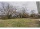 A large backyard with mature trees at 116 11Th St, Spencer, NC 28159