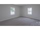 Cozy bedroom with natural light pouring in from updated windows at 116 11Th St, Spencer, NC 28159