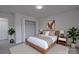 A bright bedroom featuring a wood bed frame and modern decor at 116 11Th St, Spencer, NC 28159