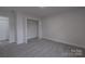 This bedroom features neutral paint, carpet, and a bi-fold closet at 116 11Th St, Spencer, NC 28159