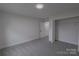 This bedroom features neutral walls, carpet flooring, and closet space for optimal organization at 116 11Th St, Spencer, NC 28159